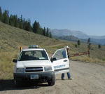 Roads into the quarantine area are blocked and manned by guards to prevent unauthorized traffic.