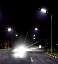 Fugitive night light from car headlights and street lights